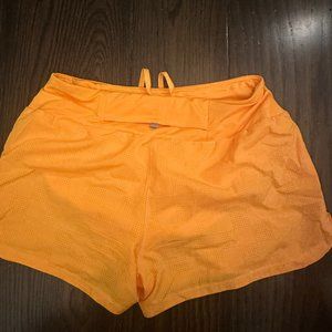 NWT Neon Orange Nike Dri fit running shorts w/ lining